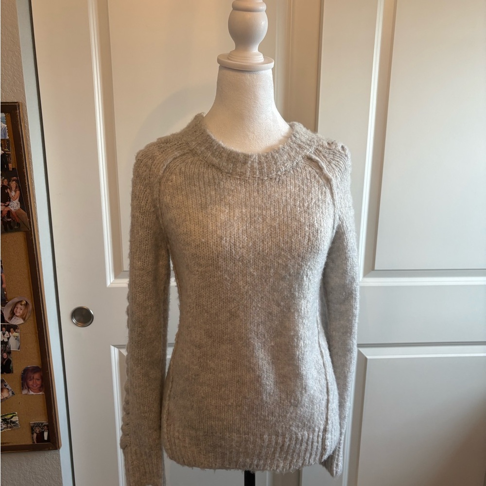 SOH 100% cashmere sweater with decorative knitting on the arms. New with tags.